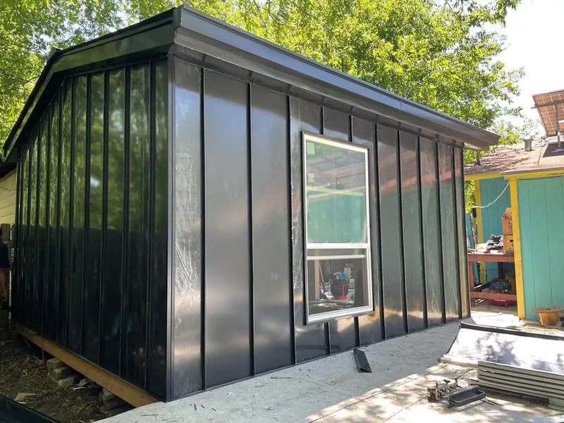 Black standing seam metal wall panels for Roof Inspection in Raymond