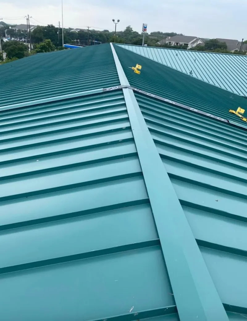 Green commercial metal roof ridge and valley for Metal Roof Repair in Raymond