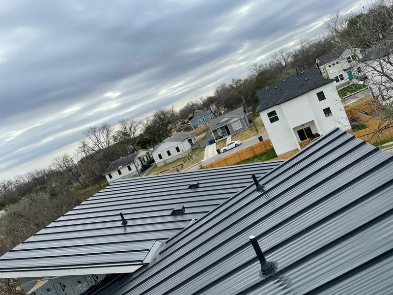Standing seam metal roof panels with vents for Skylight Repair in Raymond